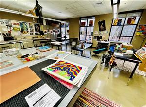 art classroom at Hewitt-Trussville High School with paintings on tables